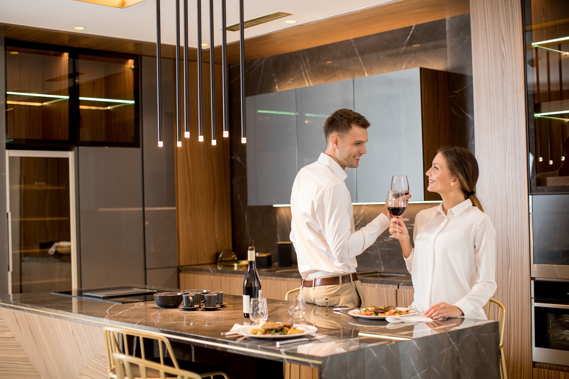 Couple having dinner in a luxurious kitchen